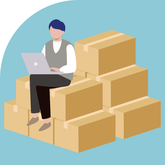 段ボール箱が積み上げられた上に座り、ノートパソコンで作業している人物のイラスト。