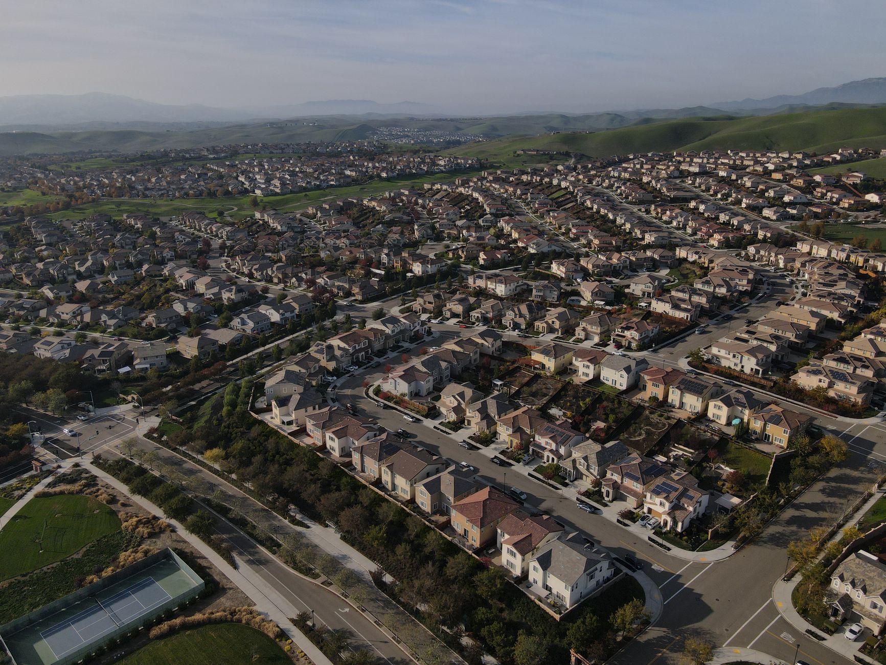 Wide aerial shot of Dublin, CA suburbs showcasing a sprawlin