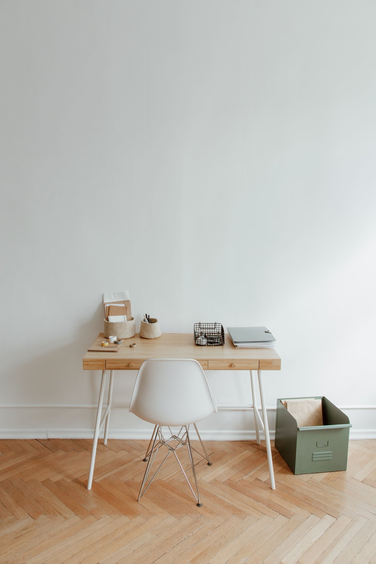 Clean and simple home office setup featuring a wooden desk,