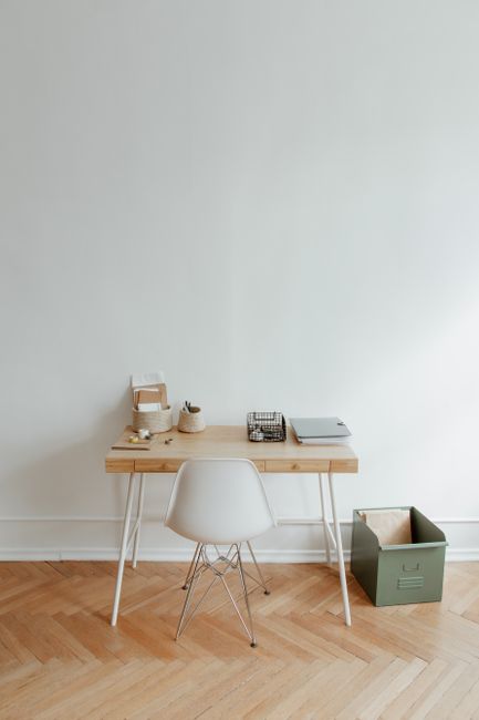 Clean and simple home office setup featuring a wooden desk,