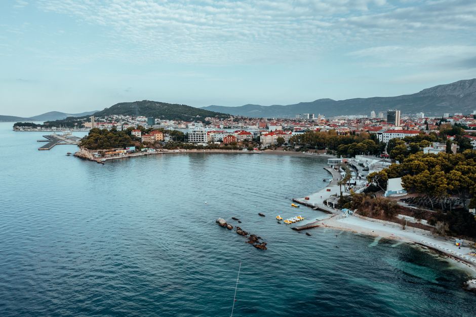 Drone shot of Split's beautiful coastline, featuring a sceni