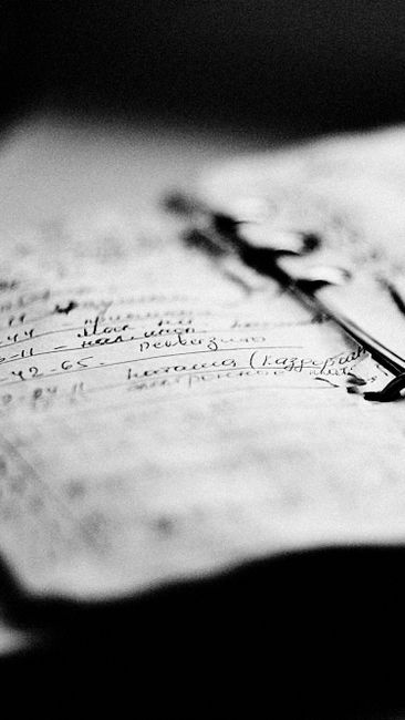 Elegant black and white photo depicting handwritten notes in
