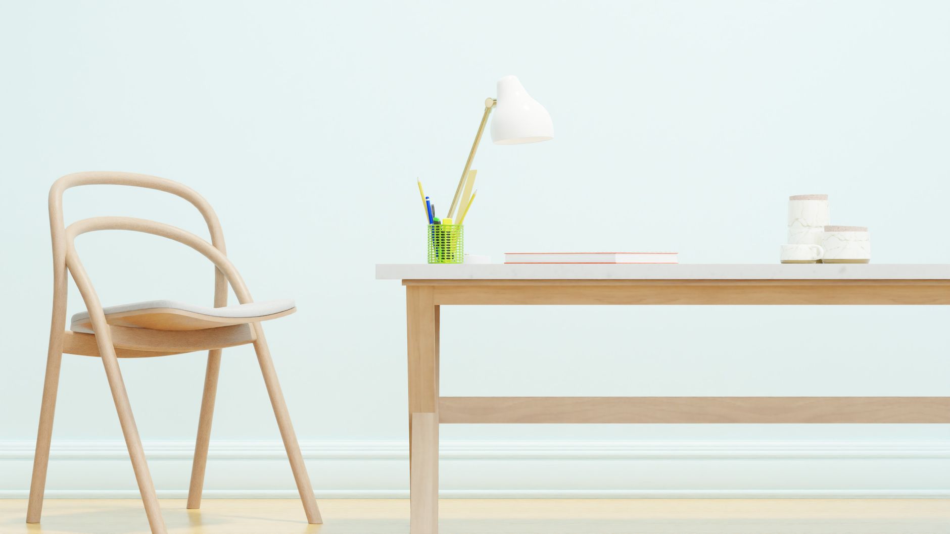 A minimalist office space featuring a wooden chair and desk,