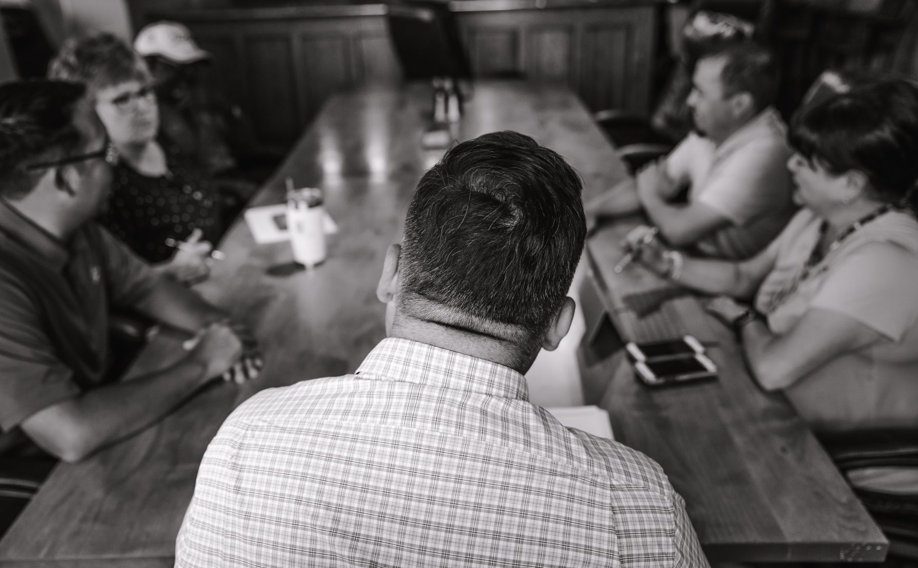 A group of professionals engaged in a discussion in a confer