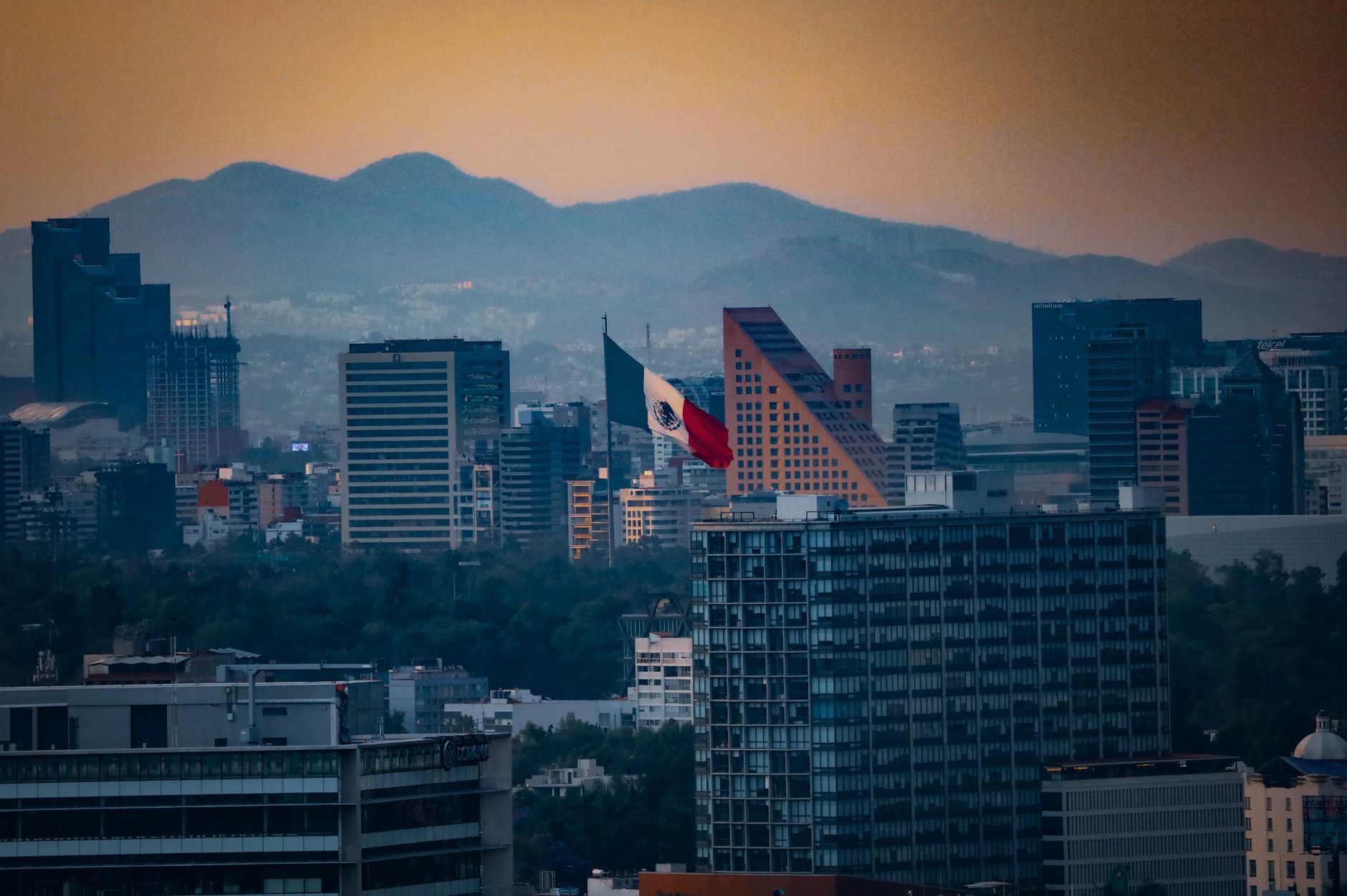 Stunning cityscape of Mexico City with the Mexican flag and