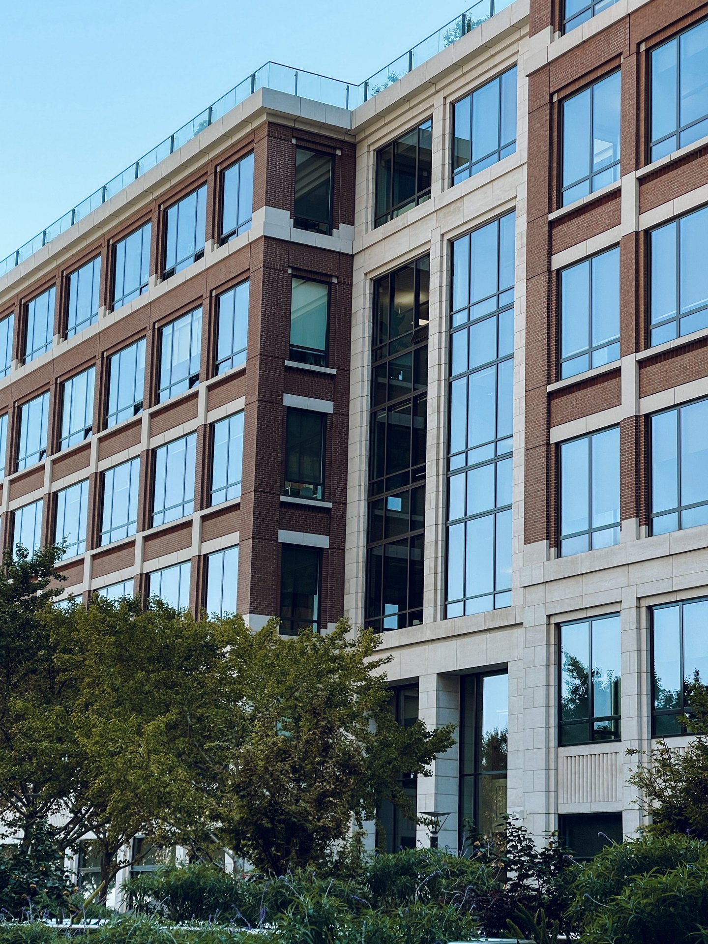 Contemporary office building exterior featuring large glass