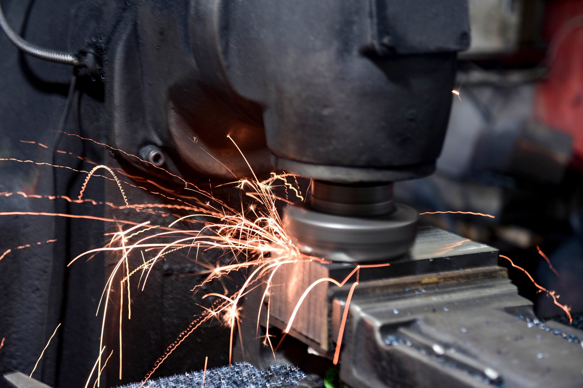 Close-up of a grinding machine in action with sparks flying