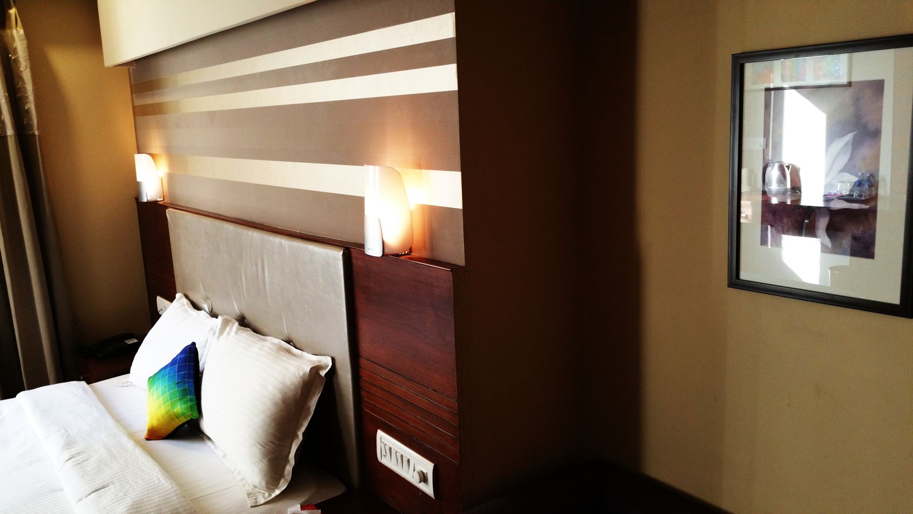 Stylish modern bedroom featuring cozy lighting, designer pil