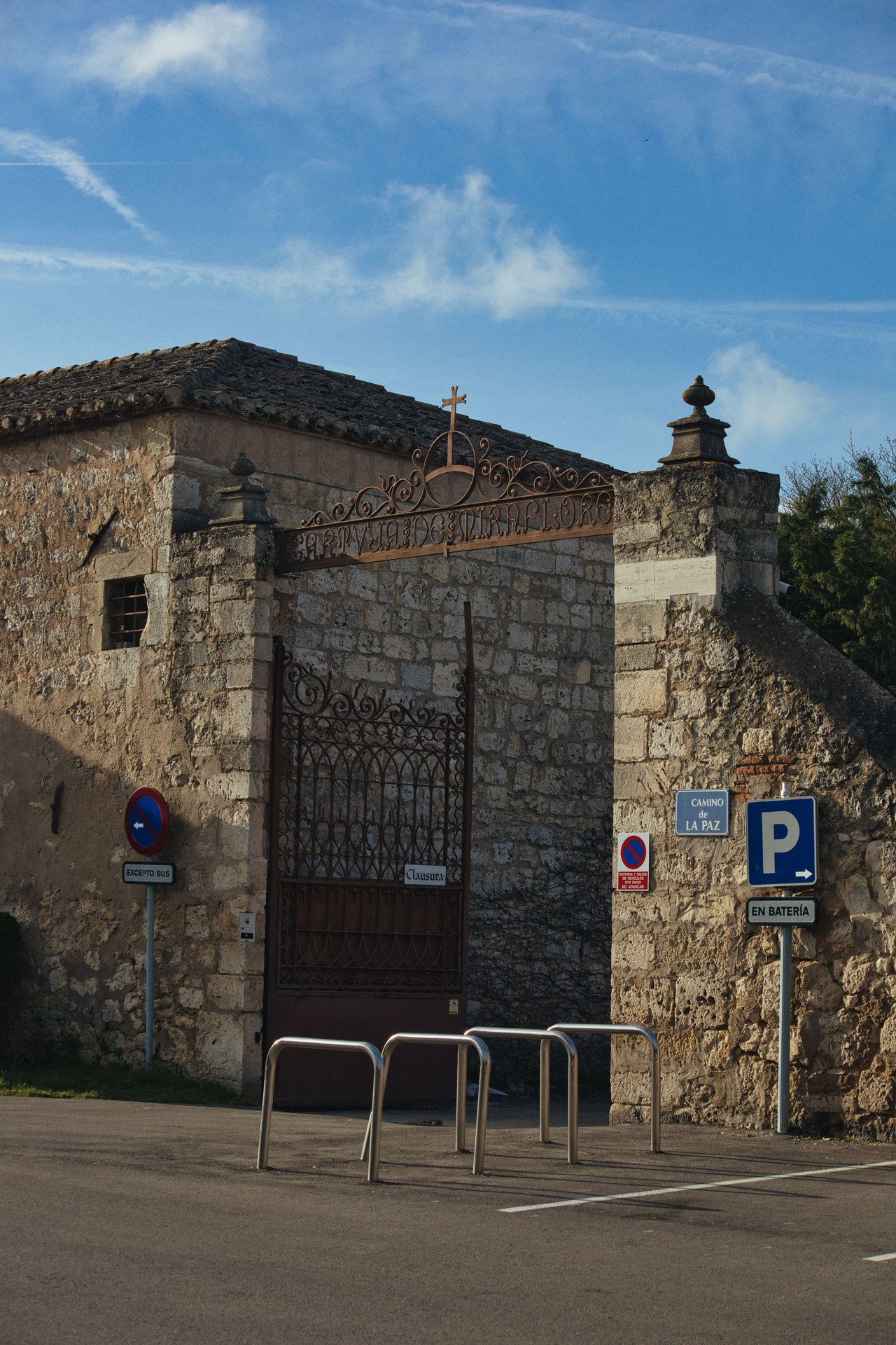 Explore this historic stone building with an ornate iron gate, perfect for vintage urban themes.