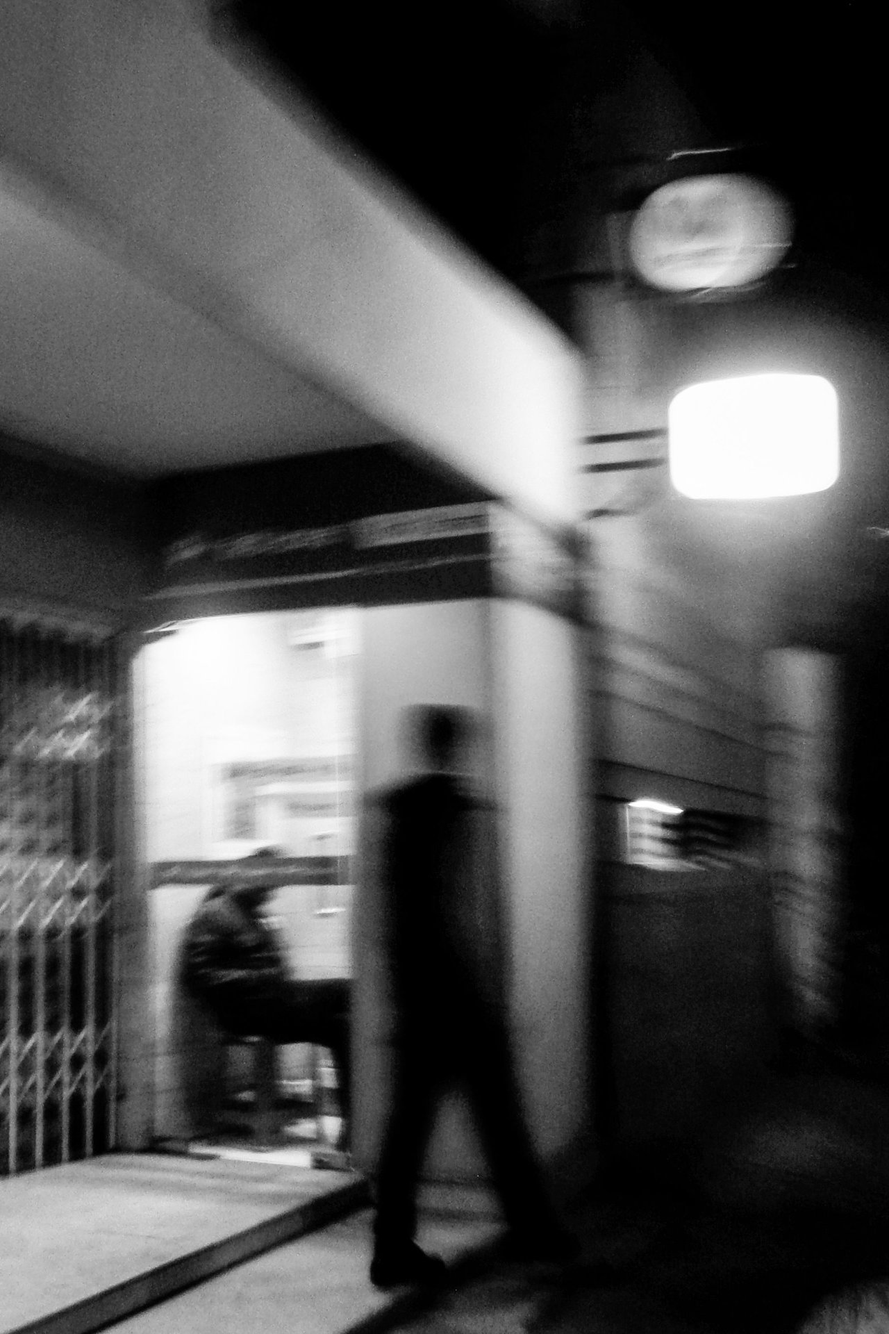 Blurred black and white photo of urban night scene in Dhaka,
