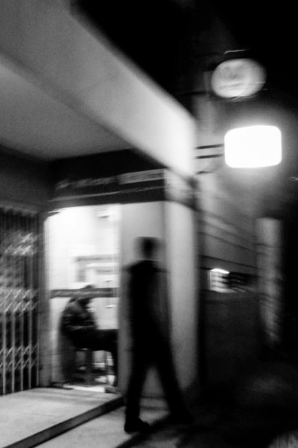 Blurred black and white photo of urban night scene in Dhaka,