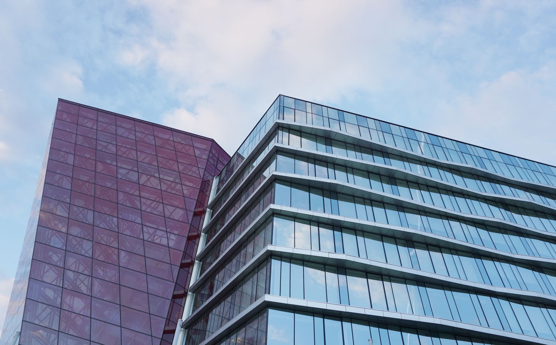 Contemporary urban architecture with glass and red facade ag