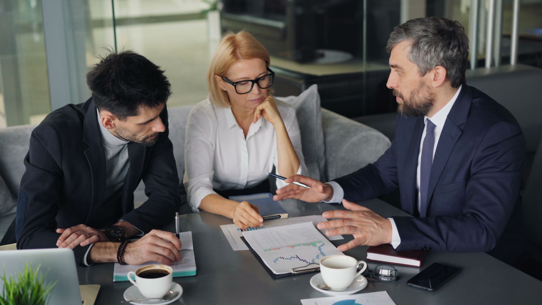 Professional colleagues engaged in a business meeting discus