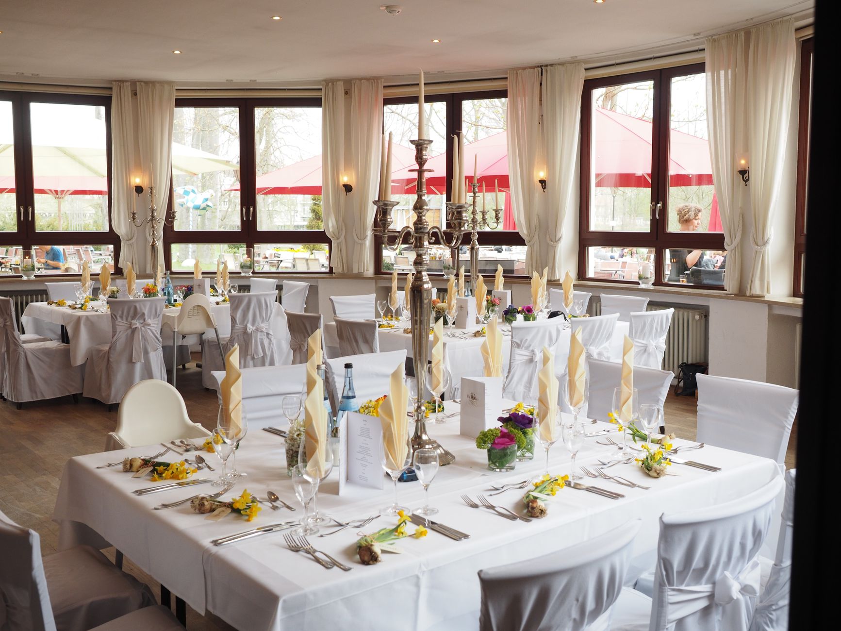 A beautifully arranged dining room with elegant table settin