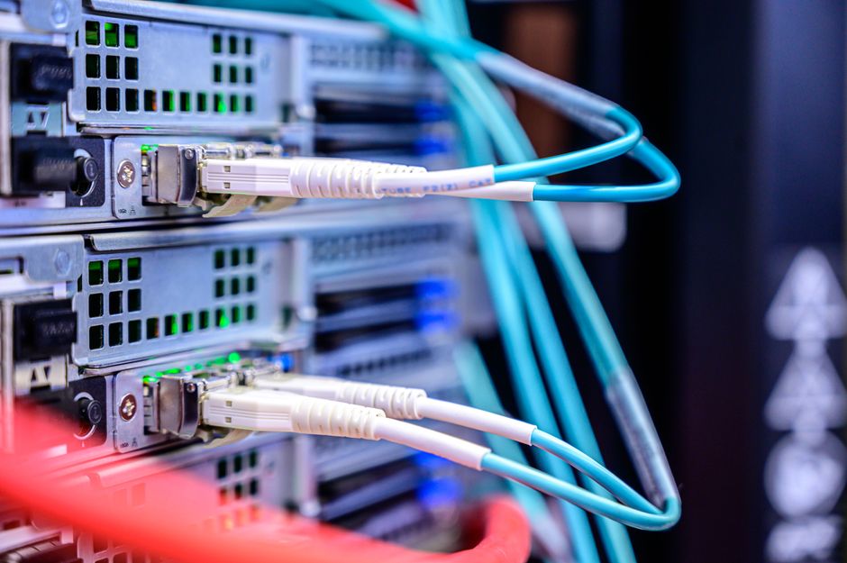 Detailed shot of Ethernet cables connected to server ports h