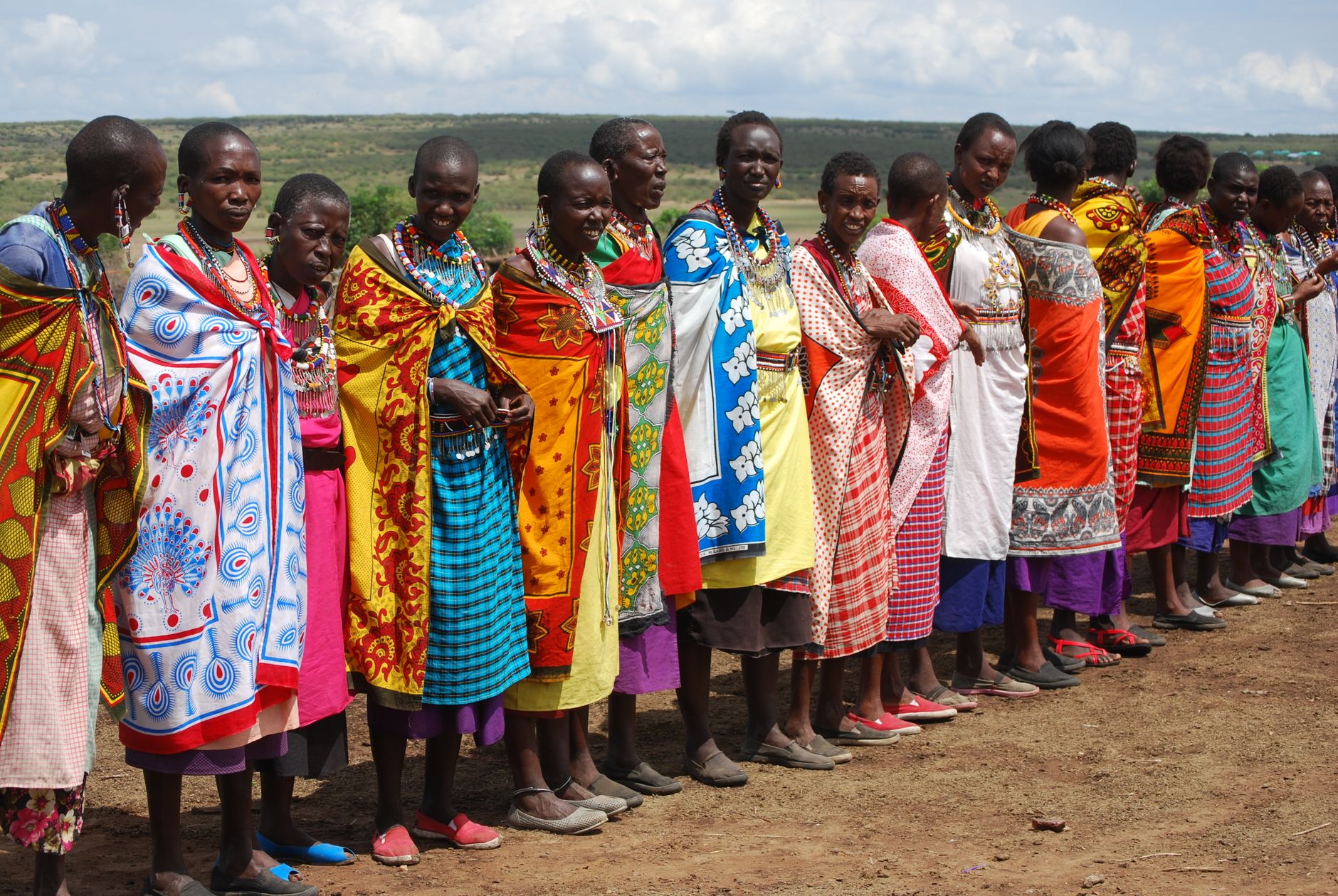 A vibrant display of Maasai women in traditional attire in K