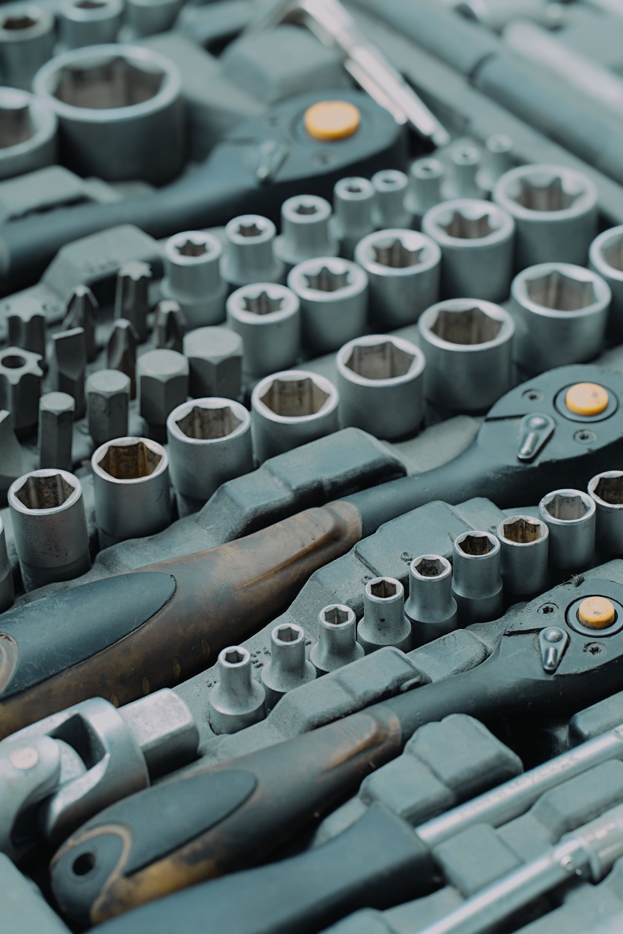 Detailed view of a ratchet and socket tool set, ideal for me