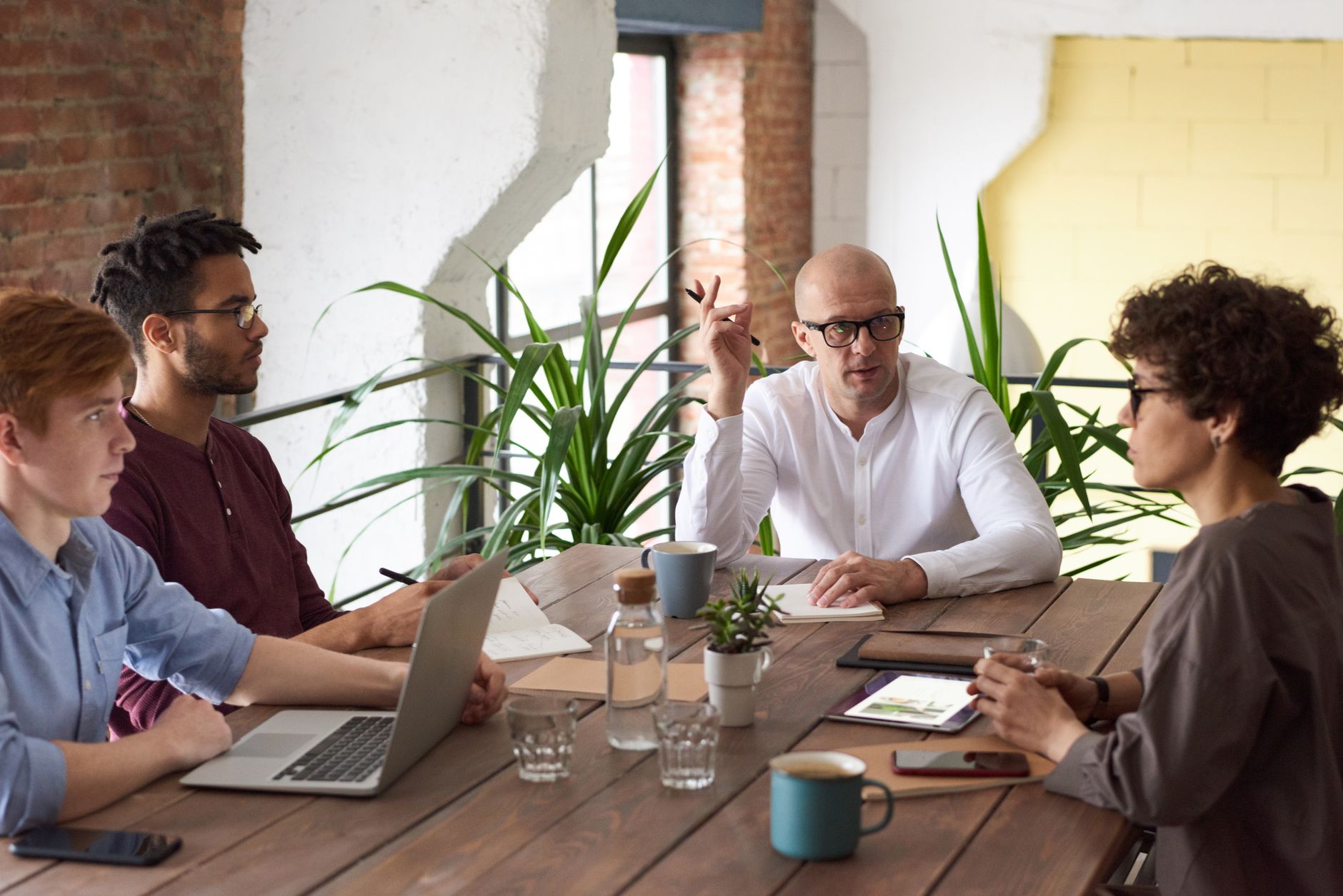 A group of colleagues in a modern office having a strategic
