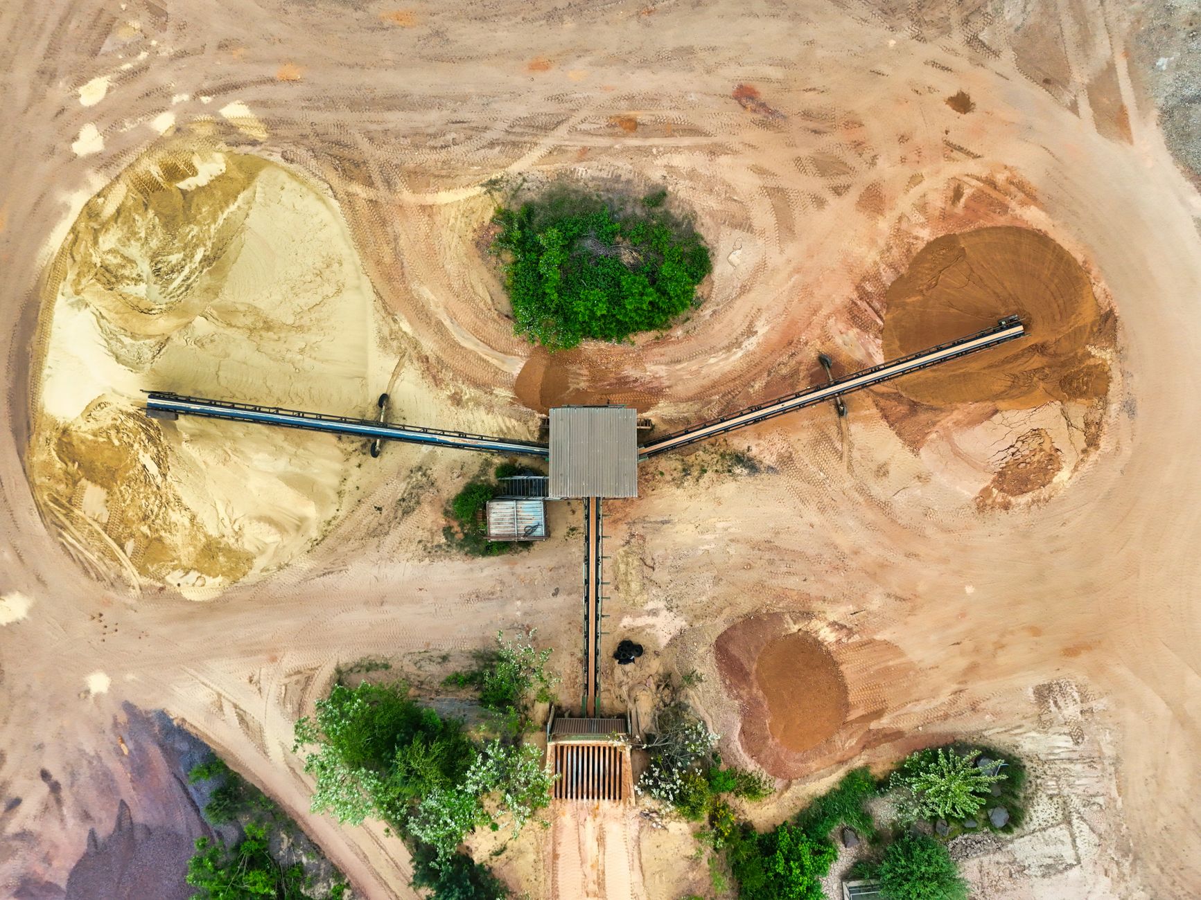 Aerial shot of a mining site featuring conveyor belts and sa