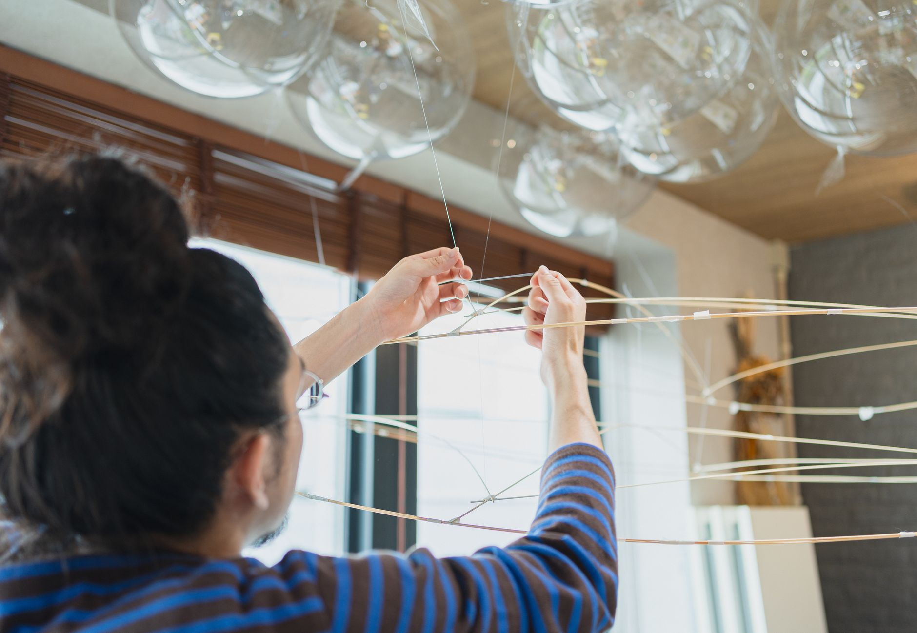 Artist working on a contemporary art installation inside a S