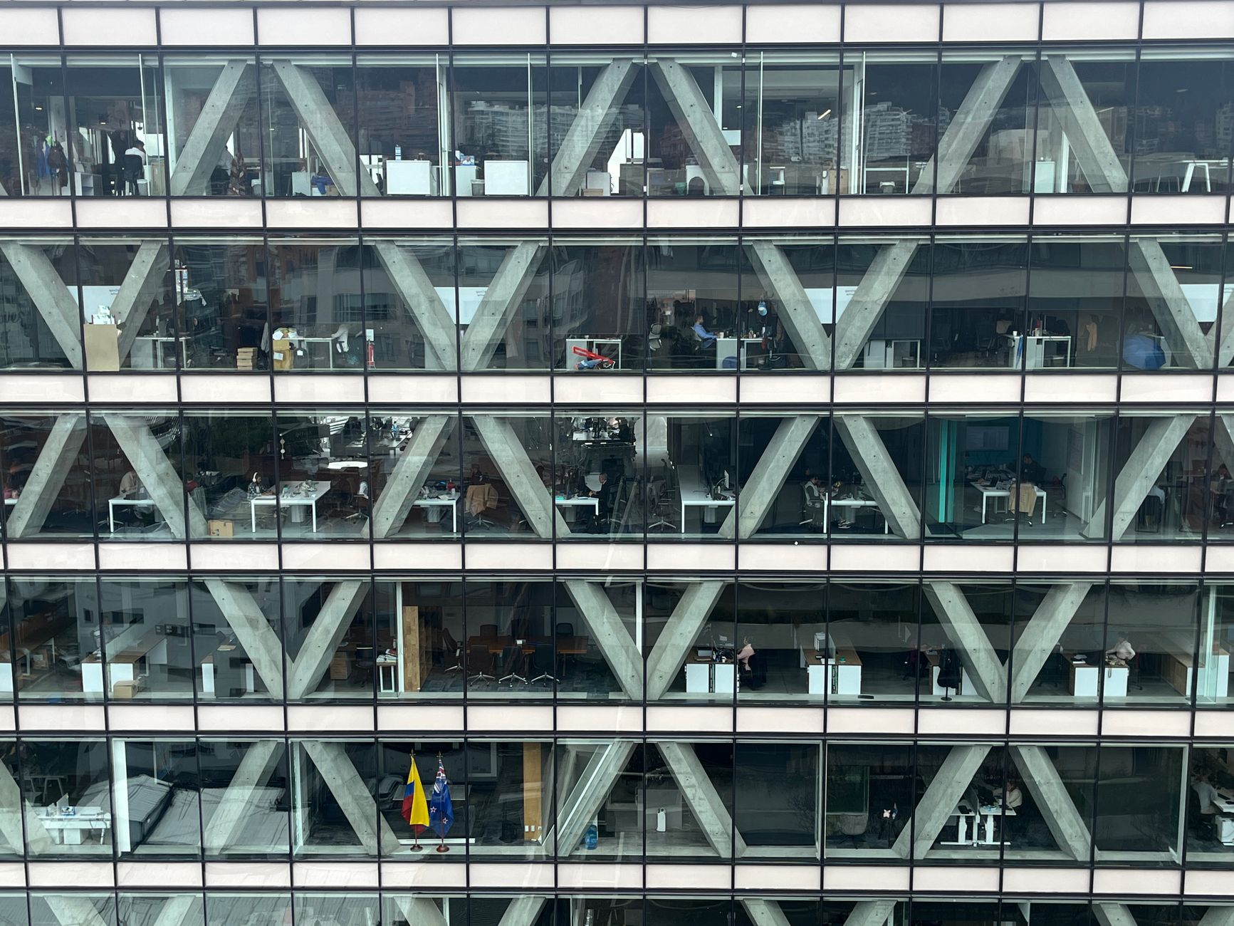 Office building facade with glass windows and geometric patt