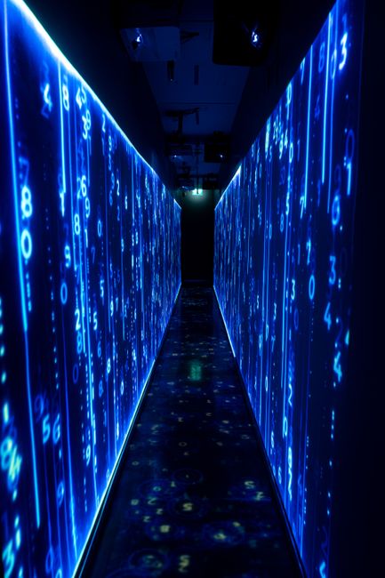 A luminous blue tunnel with digital numbers creating a futur