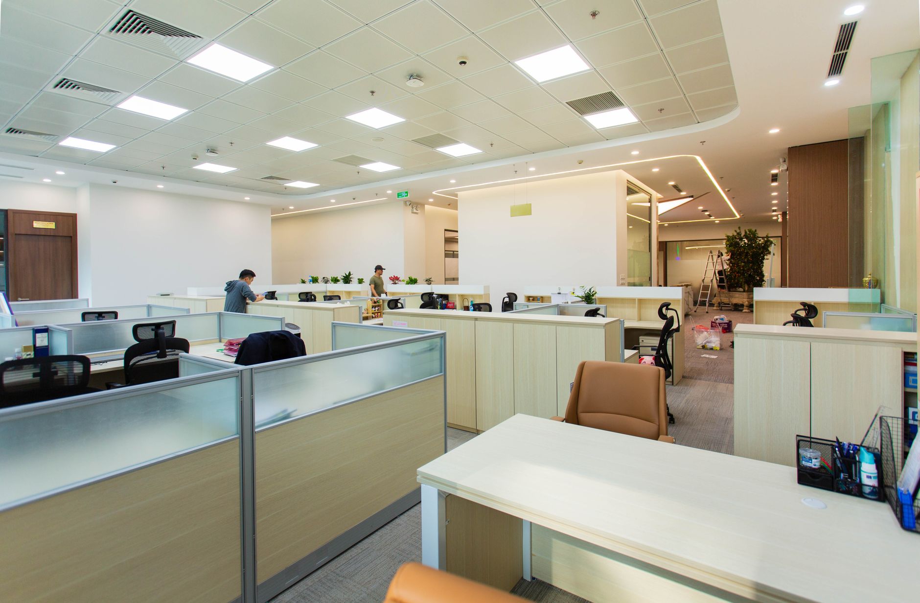 Bright and spacious office interior featuring open-plan cubi