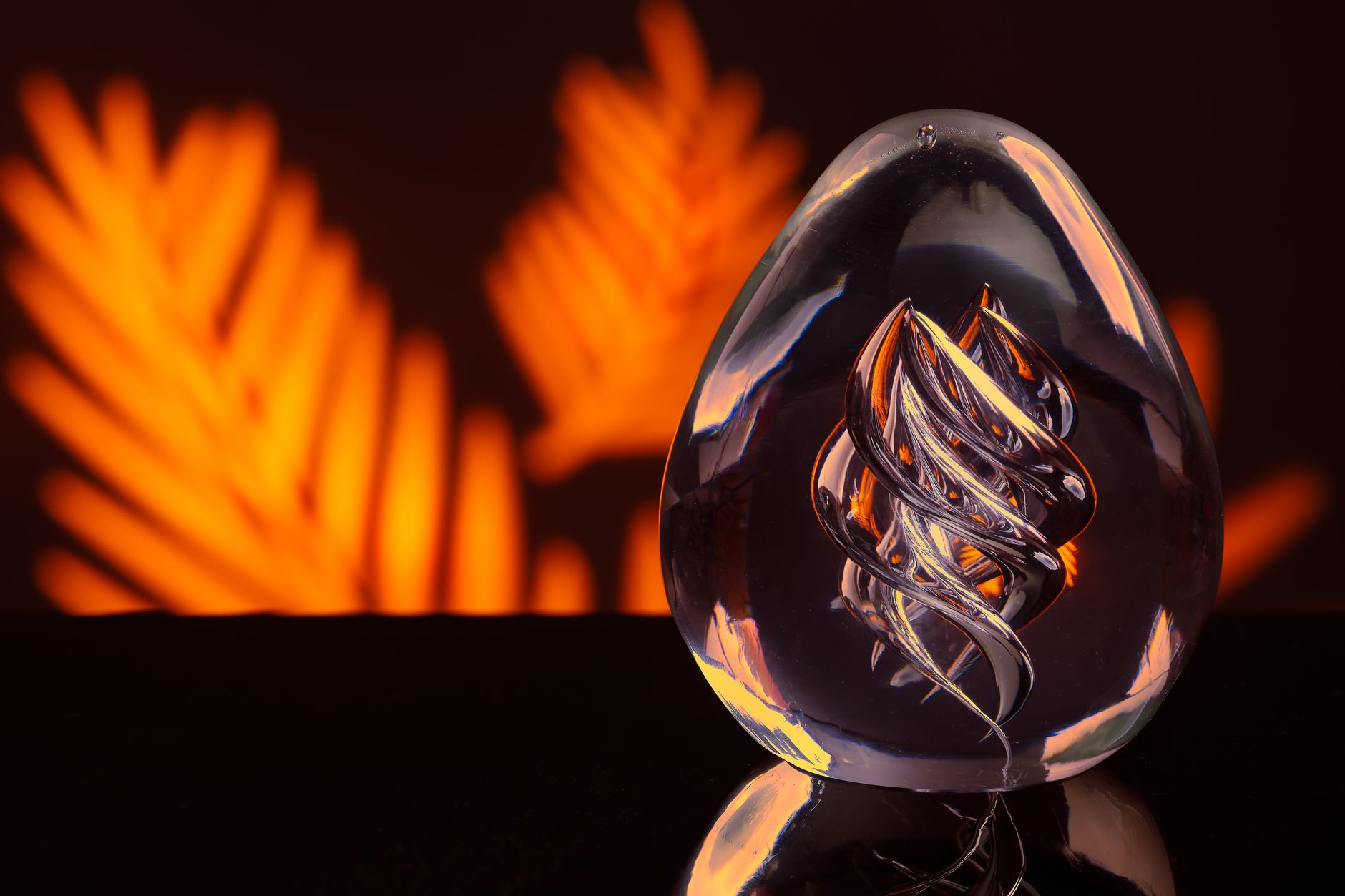 Close-up of a glass sculpture with intricate design against