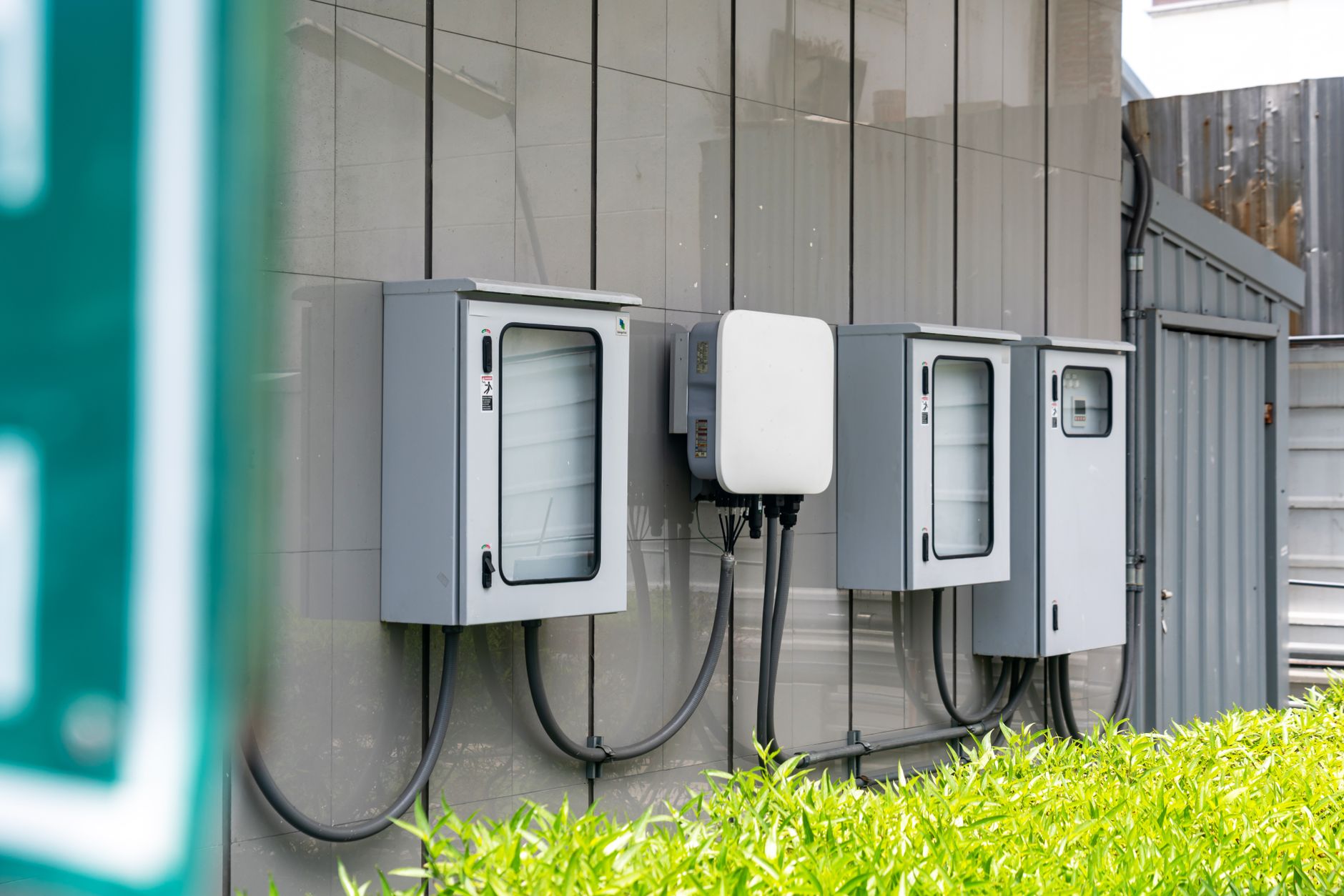 Close-up of outdoor electrical utility boxes with cabling on