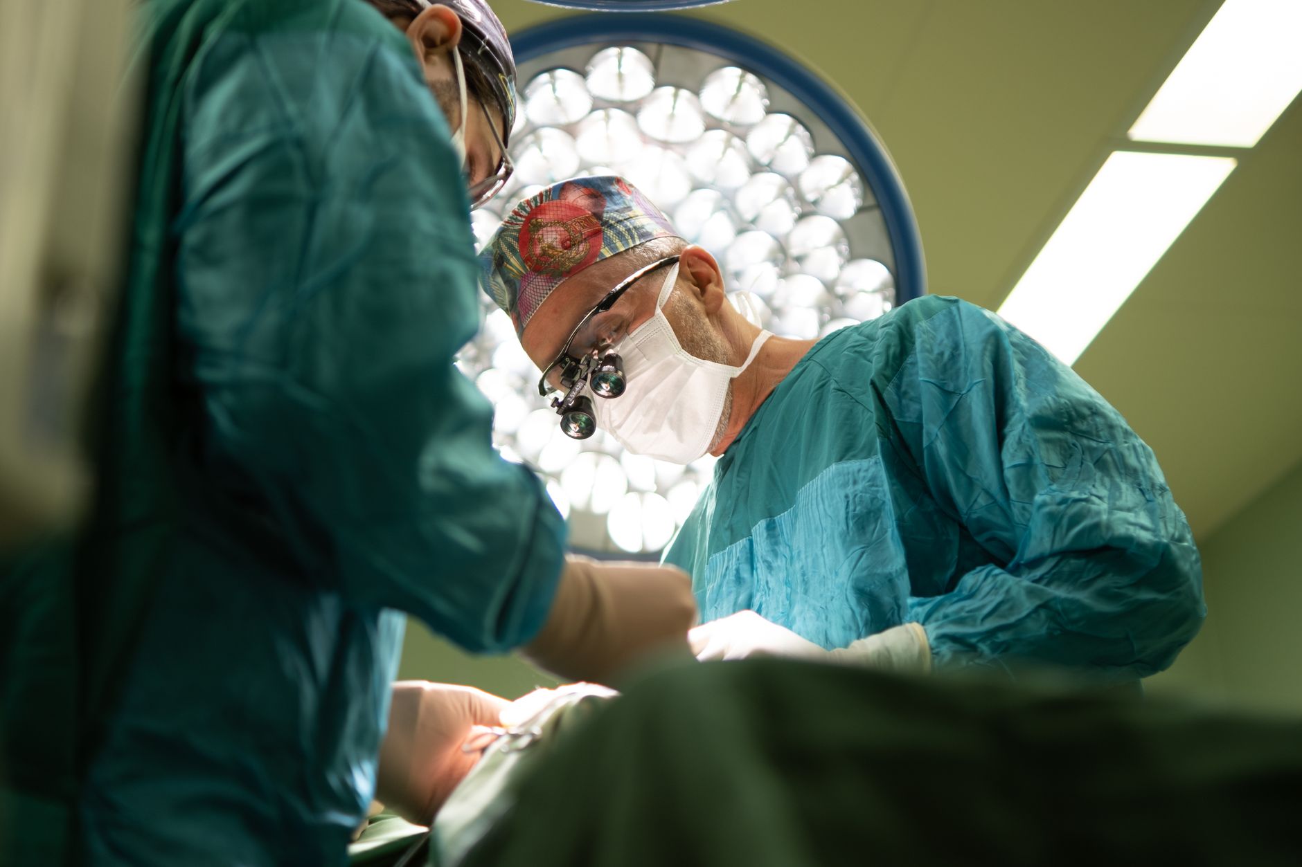 Two surgeons focused on performing an operation in a sterile