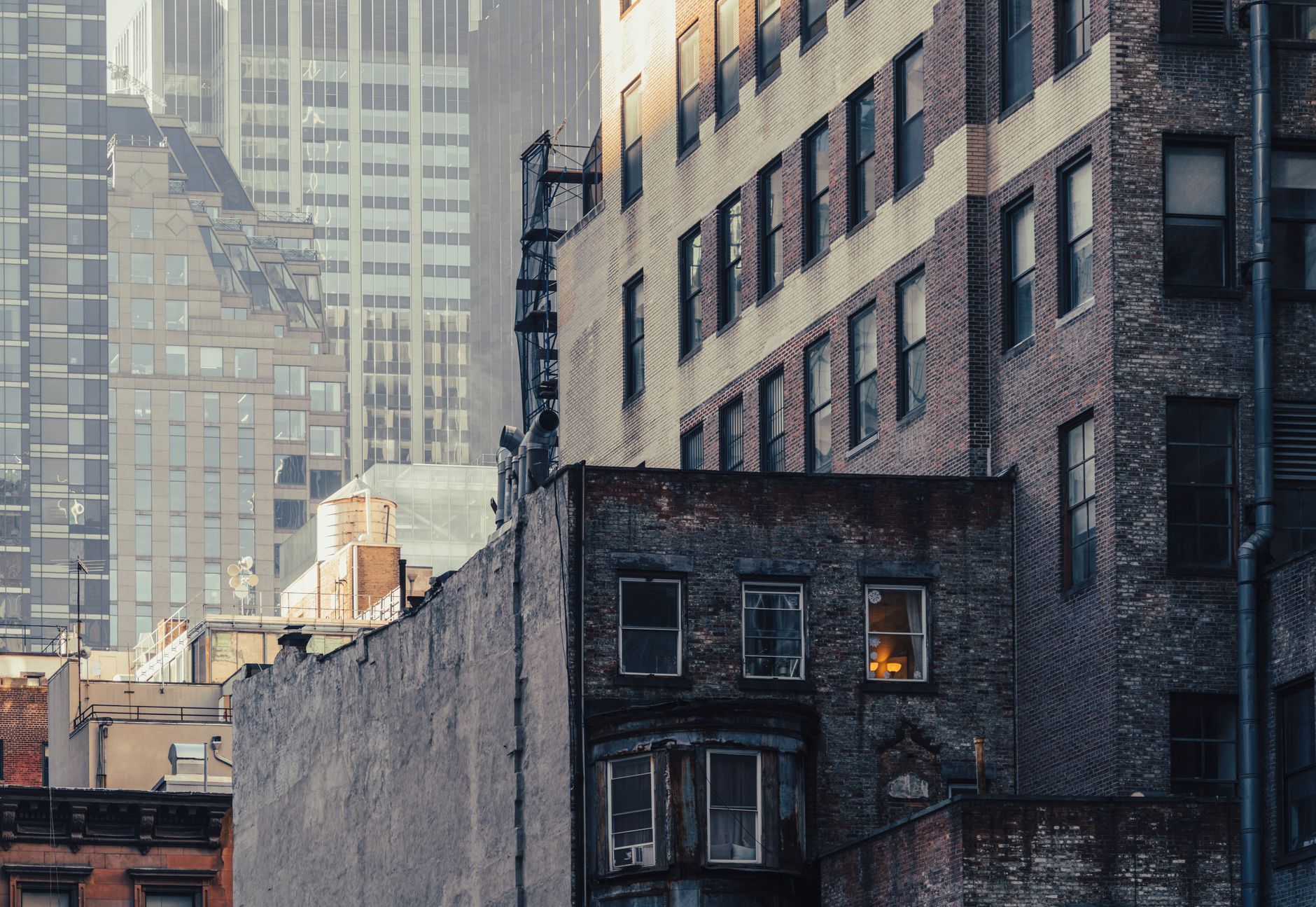Dramatic view of contrasting architectural styles at dusk in