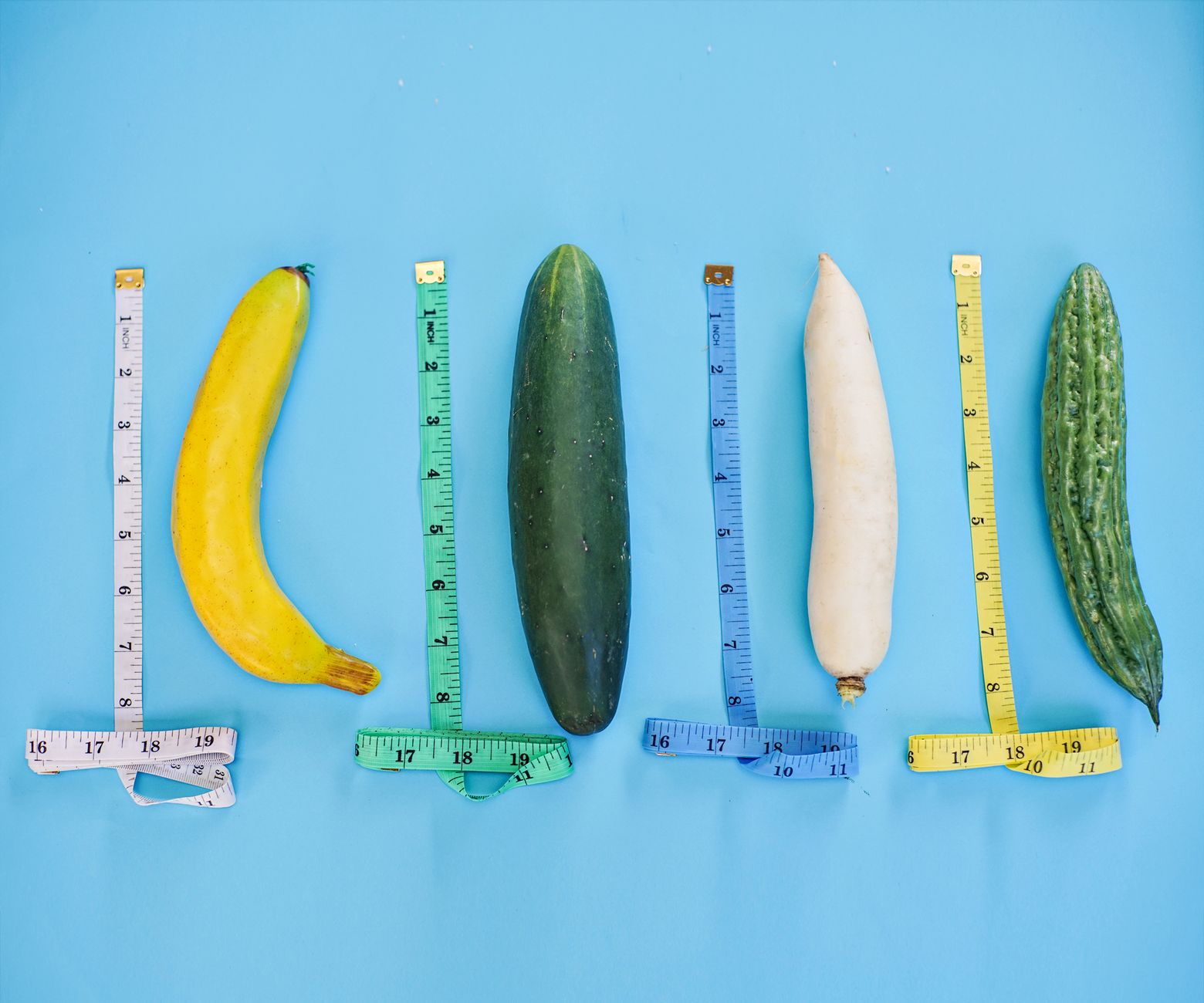 A vibrant still life of various vegetables and measuring tap