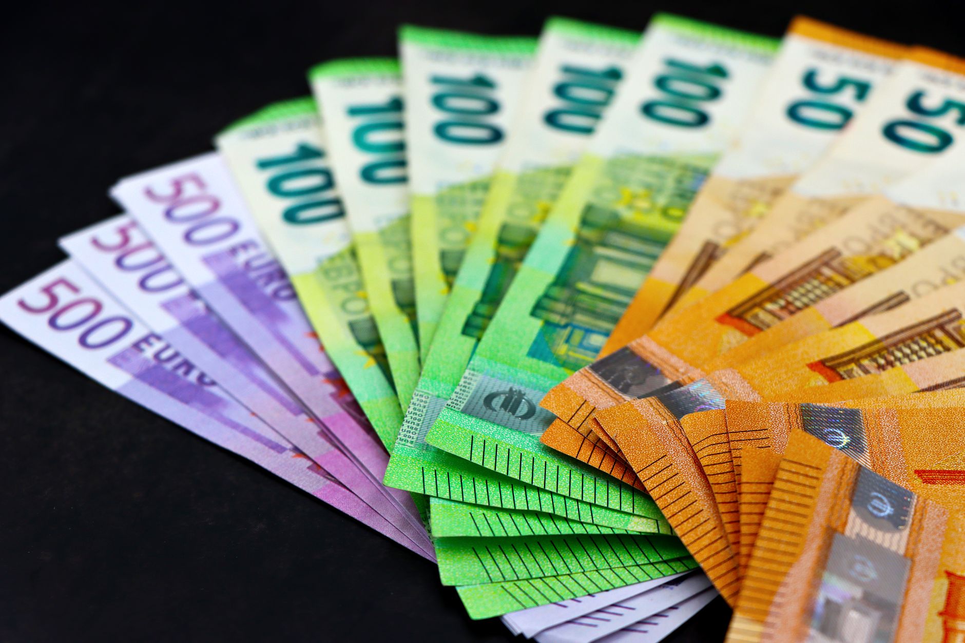 Close-up of colorful euro banknotes fanned out, showcasing c