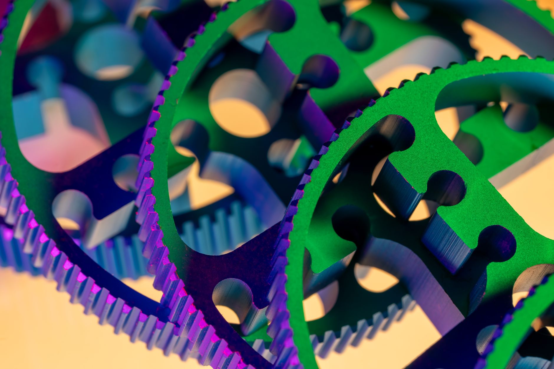 Vivid macro close-up of colorful interlocking gears showcasing precision engineering and technology.