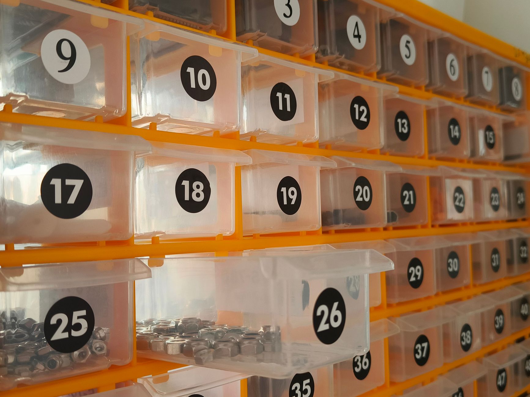 Side view of a hardware storage system with numbered bins co