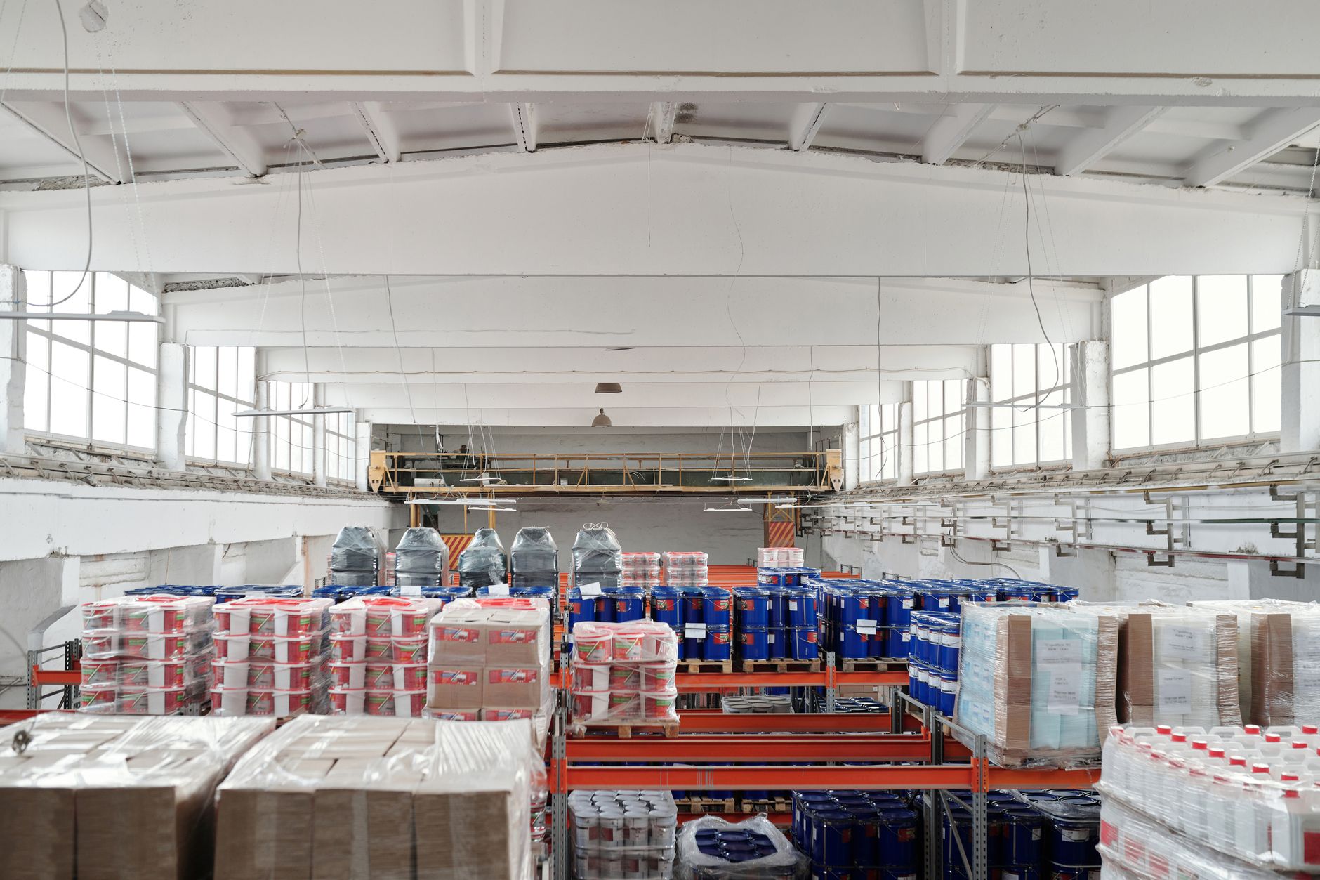 Spacious warehouse interior featuring organized shelves with