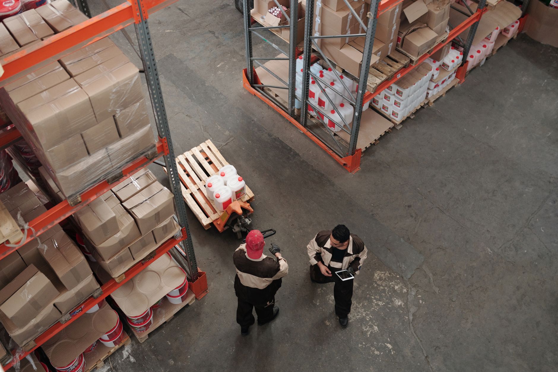 High angle view of warehouse workers organizing inventory wi