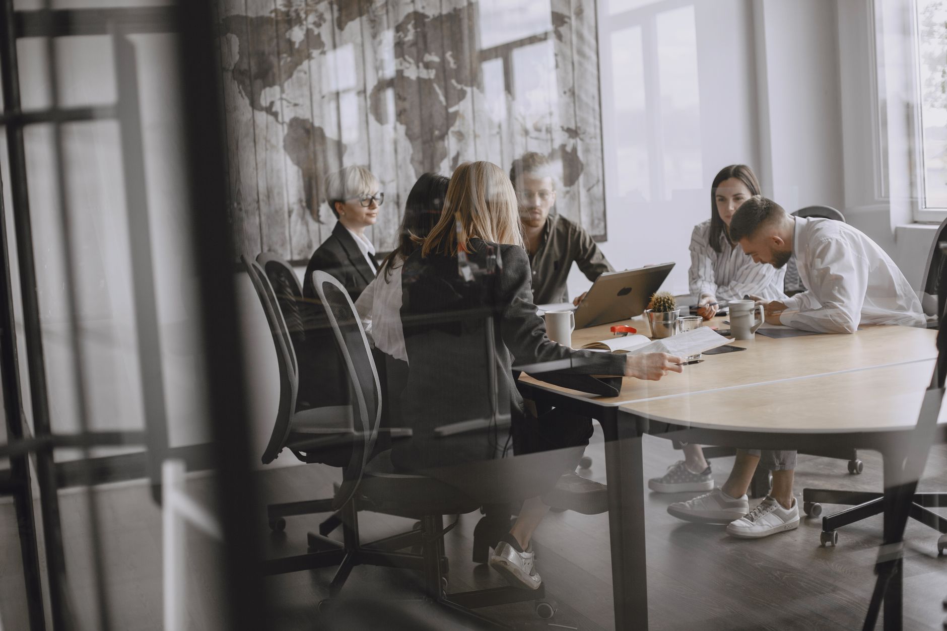 Professionals in a meeting room engaged in a collaborative b