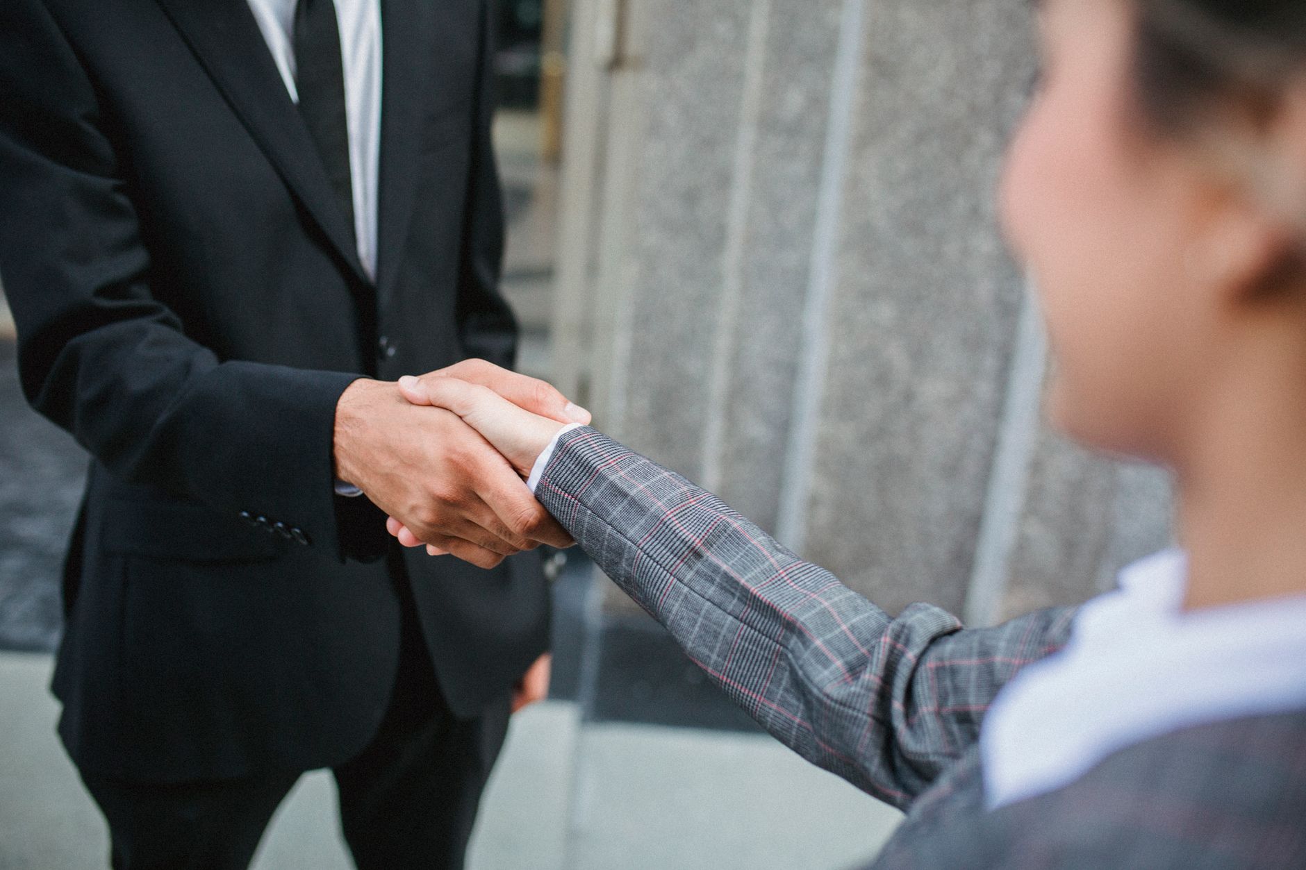 Professional handshake symbolizing partnership and cooperati