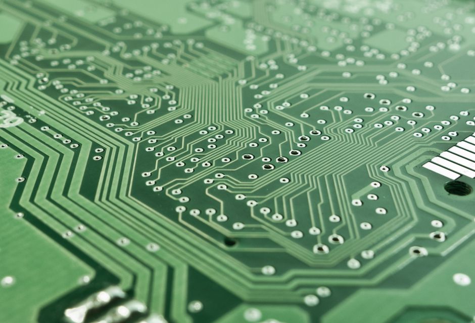 Detailed view of a green circuit board with complex patterns