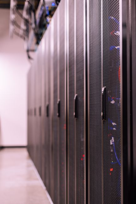 Row of similar lockers with various optic fiber cables in mo