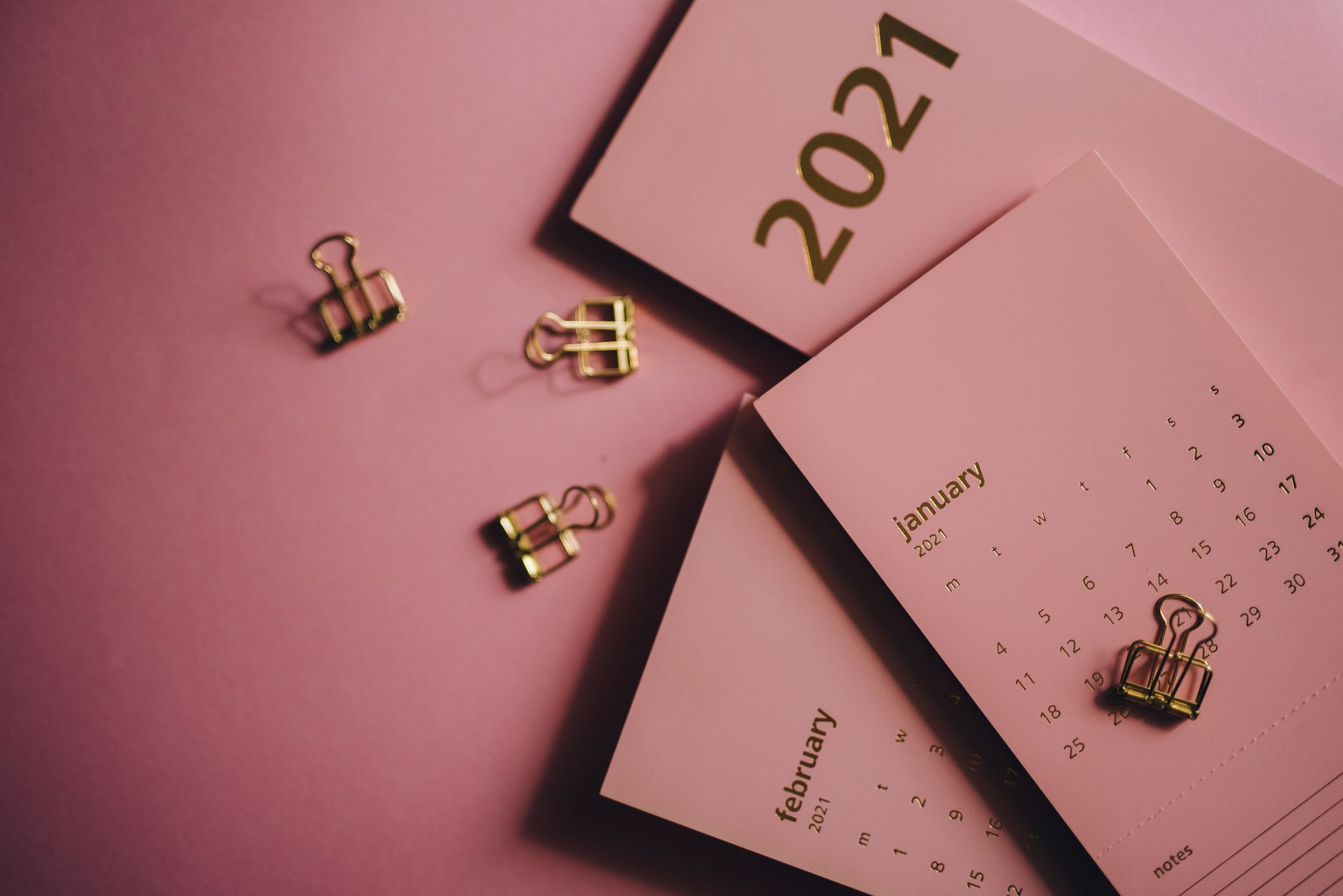 Overhead view of collection of modern monthly calendars near