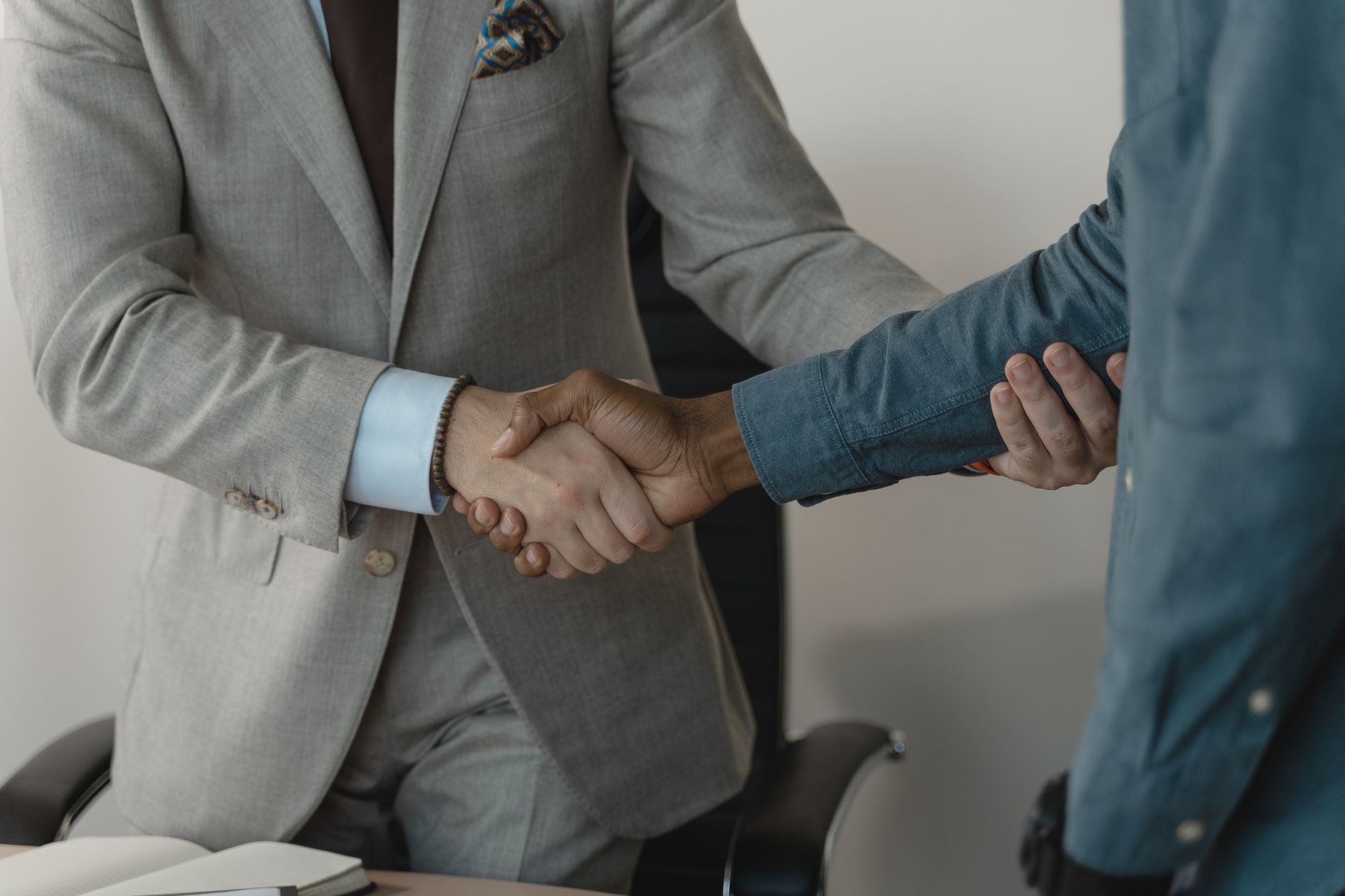 Image of a professional handshake between two businessmen in
