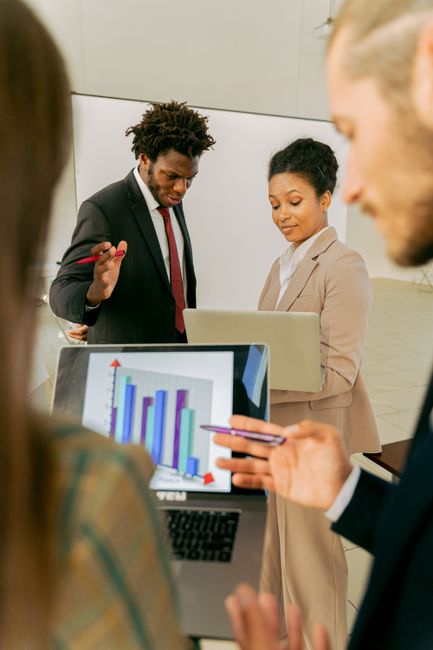 Professionals collaborating in a modern office setting, disc