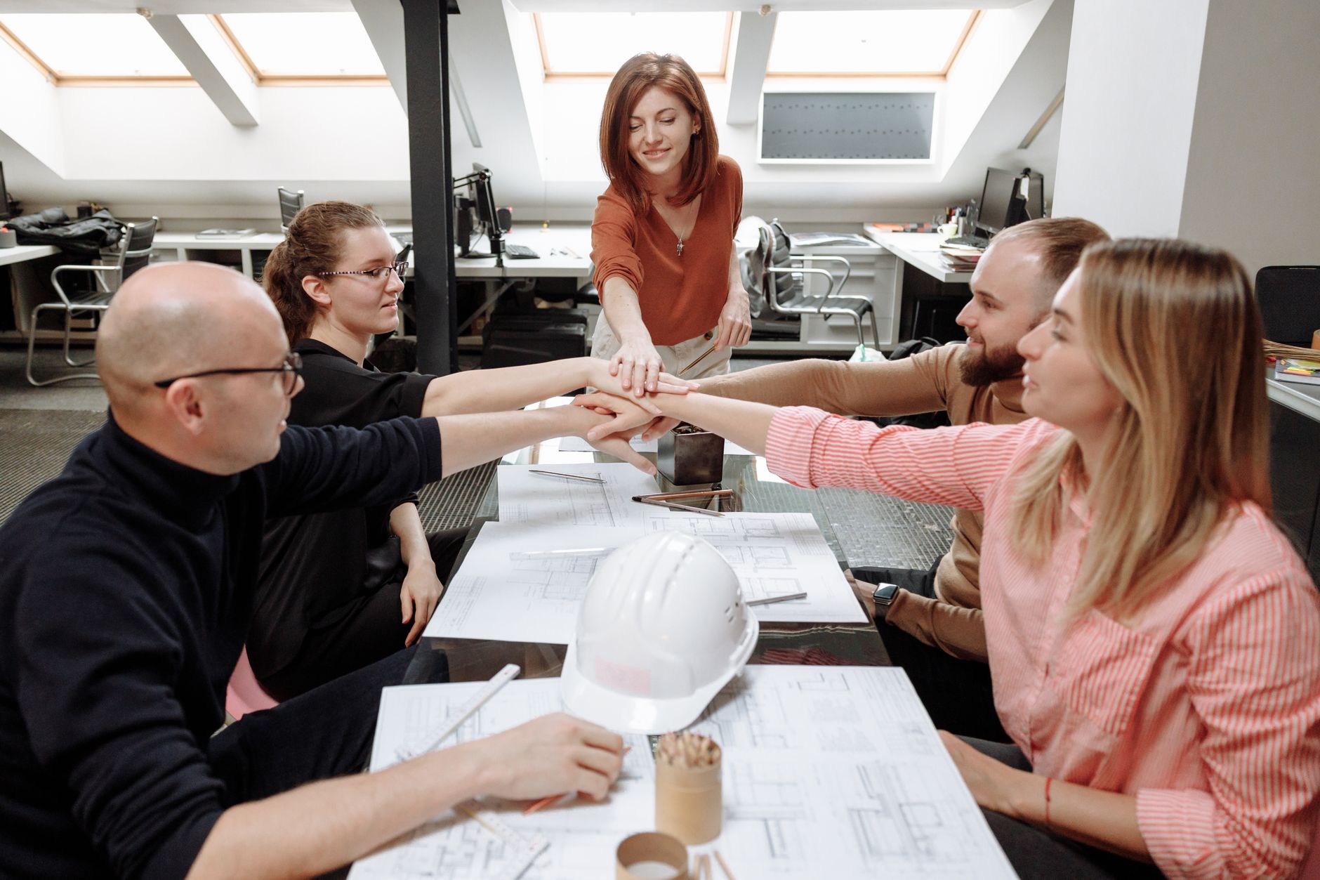 Architects collaborate on project plans in a modern office s