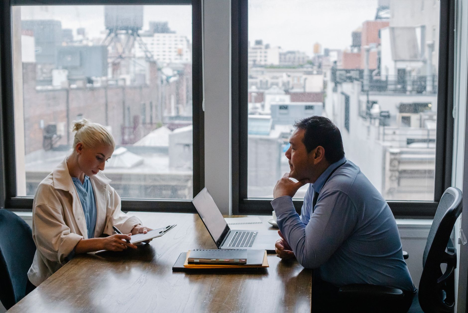 Business meeting between colleagues in a modern office setti