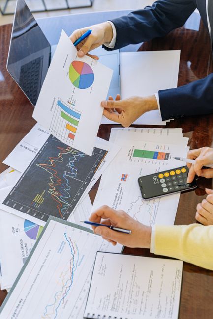 Business professionals analyzing financial charts and graphs