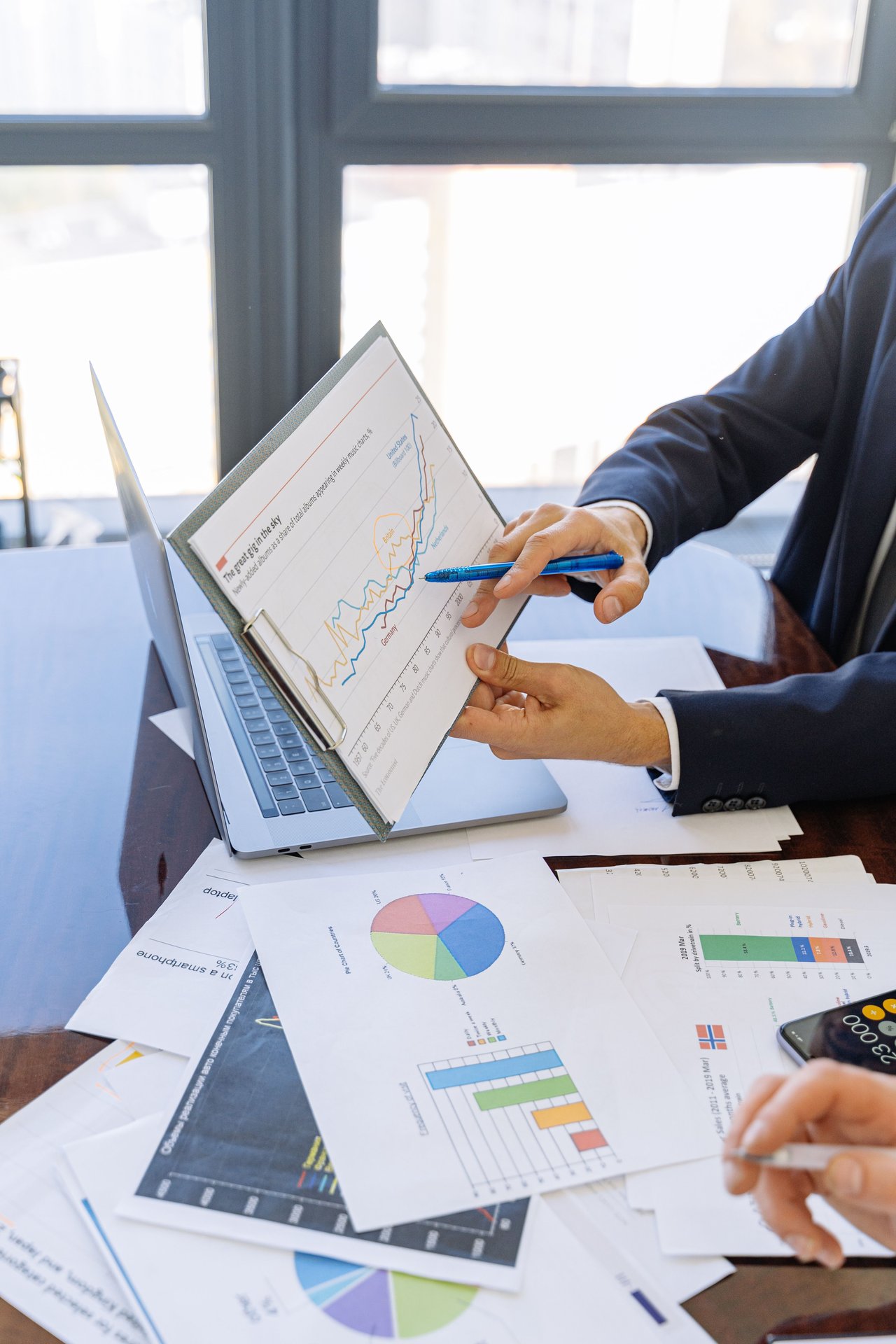 Business professionals discussing financial graphs and chart