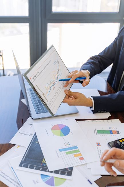 Business professionals discussing financial graphs and chart