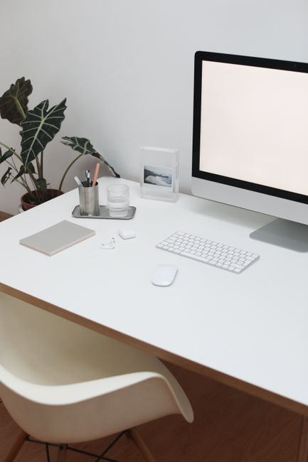 High angle of contemporary workplace with computer and offic